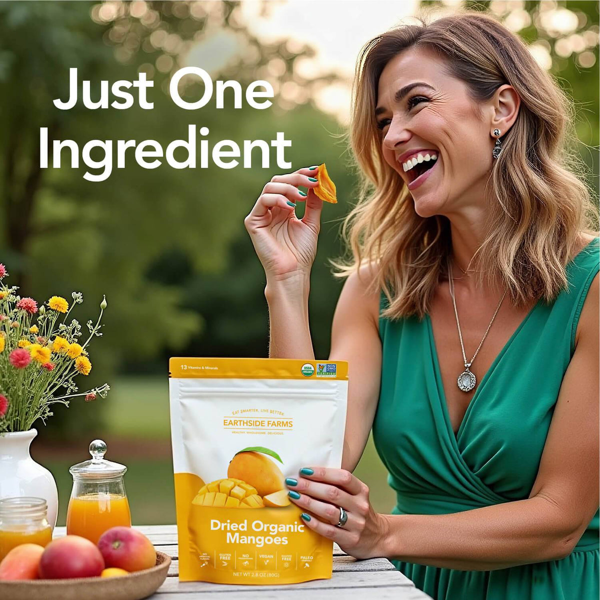 Laughing woman eating dried mango beside a Dried Organic Mangoes pouch