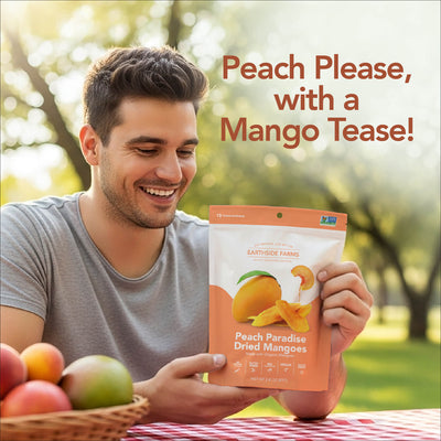 Smiling man at a picnic holding a Peach Paradise Dried Mangoes pouch